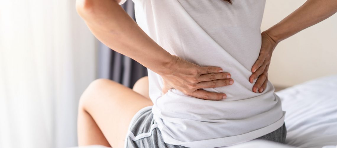 Woman,Suffering,From,Back,Ache,On,The,Bed,,Healthcare,And